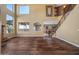 Spacious living room featuring hardwood floors and a grand staircase at 16118 W Gibson Ln, Goodyear, AZ 85338