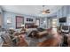 Main bedroom with hardwood floors, ceiling fan, and plenty of natural light at 16118 W Gibson Ln, Goodyear, AZ 85338