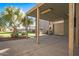 Covered patio with concrete flooring and wooden beams at 16118 W Gibson Ln, Goodyear, AZ 85338