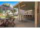 Outdoor patio with bar and seating area, covered structure at 16118 W Gibson Ln, Goodyear, AZ 85338