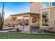 Backyard patio with hot tub and covered seating area at 16118 W Gibson Ln, Goodyear, AZ 85338