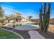 Relaxing backyard pool with surrounding landscaping at 16118 W Gibson Ln, Goodyear, AZ 85338