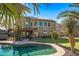 Expansive pool with lush landscaping and a putting green at 16118 W Gibson Ln, Goodyear, AZ 85338