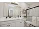 Modern bathroom with double vanity and a large shower at 16530 N Dante Way, Maricopa, AZ 85138