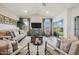 Living room with sliding glass doors to the patio at 16530 N Dante Way, Maricopa, AZ 85138