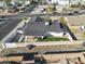 Aerial view showing a single-story home with a backyard patio and lawn at 1703 E Laguna Dr, Tempe, AZ 85282