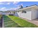 Backyard view showing the home's exterior and lawn at 1703 E Laguna Dr, Tempe, AZ 85282