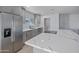 Sleek kitchen with stainless steel appliances and a large marble island at 1703 E Laguna Dr, Tempe, AZ 85282