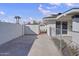 Side yard with storage shed and chain link fence at 1703 E Laguna Dr, Tempe, AZ 85282