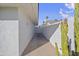 Side yard with concrete slab and cactus plant at 1703 E Laguna Dr, Tempe, AZ 85282