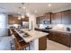 Modern kitchen with an island and stainless steel appliances at 17215 W Corrine Dr, Surprise, AZ 85388