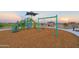 Modern playground with slides, swings, and shade structure at 17215 W Corrine Dr, Surprise, AZ 85388