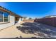 Large gravel backyard, walled for privacy, providing a blank canvas for landscaping and outdoor enjoyment at 17469 N 66Th Ave, Glendale, AZ 85308