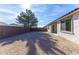 The spacious backyard features low-maintenance desert landscaping and a block wall for added privacy at 17469 N 66Th Ave, Glendale, AZ 85308