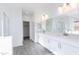 Bright bathroom with white cabinetry, quartz countertops, and a walk-in shower and tub combo at 17469 N 66Th Ave, Glendale, AZ 85308