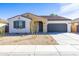 Charming single-story home with neutral stucco, tidy xeriscaping, and a two-car garage at 17469 N 66Th Ave, Glendale, AZ 85308