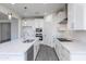 New kitchen features stainless appliances, white cabinetry and countertops and large sink at 17469 N 66Th Ave, Glendale, AZ 85308