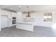 Modern kitchen featuring an island, stainless steel appliances, and white cabinetry at 17469 N 66Th Ave, Glendale, AZ 85308