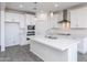 Bright kitchen island with sink, stainless steel appliances and quartz countertops at 17469 N 66Th Ave, Glendale, AZ 85308