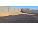 Empty lot backyard with block wall and mountain views at 17724 W Sanna St, Waddell, AZ 85355