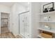 Modern bathroom with a walk-in shower and shelving at 17724 W Sanna St, Waddell, AZ 85355