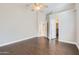 Bright bedroom with wood-look tile flooring and ceiling fan at 18487 N 111Th Dr, Surprise, AZ 85378