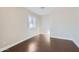 Well-lit bedroom with wood floors and window shutters at 18487 N 111Th Dr, Surprise, AZ 85378