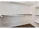 Large walk-in closet with shelving and hanging rods at 18487 N 111Th Dr, Surprise, AZ 85378