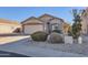 House exterior showcasing a single-story home with a garage at 18487 N 111Th Dr, Surprise, AZ 85378