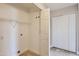 Laundry room with built-in shelving and extra storage at 18487 N 111Th Dr, Surprise, AZ 85378