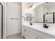 Modern bathroom with dual sinks, a large mirror, and black hardware at 18556 E Dario Rd, Gold Canyon, AZ 85118