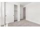 Bedroom featuring neutral carpeting, closet and connecting door to another room at 18556 E Dario Rd, Gold Canyon, AZ 85118