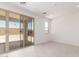 Bright bedroom featuring tile floors and a sliding glass door to the backyard at 18556 E Dario Rd, Gold Canyon, AZ 85118