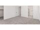 Sunlit bedroom with neutral carpet, an en-suite bathroom, and ample closet space at 18556 E Dario Rd, Gold Canyon, AZ 85118