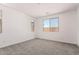 Neutral bedroom with plush carpeting and ample natural light from two windows at 18556 E Dario Rd, Gold Canyon, AZ 85118