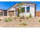 Charming home exterior with a low-maintenance yard, two-car garage, and neutral color scheme at 18556 E Dario Rd, Gold Canyon, AZ 85118