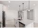 Modern kitchen with an island, stainless steel appliances, and a pantry at 18556 E Dario Rd, Gold Canyon, AZ 85118
