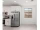 Well-lit kitchen with stainless steel appliances, white cabinets, and tile backsplash at 18556 E Dario Rd, Gold Canyon, AZ 85118