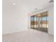 Bright living room featuring tile floors and sliding glass doors to the backyard at 18556 E Dario Rd, Gold Canyon, AZ 85118