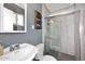 Bathroom featuring gray tile floors and shower, with a vintage white sink at 1905 W 2Nd St, Mesa, AZ 85201