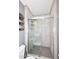 Bathroom with tiled walls and a glass enclosed shower with gray tile floors at 1905 W 2Nd St, Mesa, AZ 85201