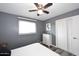 Bedroom features ceiling fan, gray walls, and luxury vinyl plank flooring at 1905 W 2Nd St, Mesa, AZ 85201