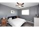 Bedroom features ceiling fan, gray walls, and luxury vinyl plank flooring at 1905 W 2Nd St, Mesa, AZ 85201