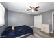 Bedroom featuring wood-look floors, a ceiling fan, and a closet with white doors at 1905 W 2Nd St, Mesa, AZ 85201