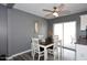 Cozy dining area featuring a ceiling fan and sliding glass doors leading to the outside at 1905 W 2Nd St, Mesa, AZ 85201