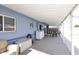 View of a covered patio with space for laundry hookups, seating, and dining at 1905 W 2Nd St, Mesa, AZ 85201