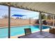 A backyard pool with an adjacent covered patio area for dining and relaxing at 1905 W 2Nd St, Mesa, AZ 85201