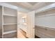 Large walk-in closet with shelving and built-in organizers at 19530 E Via Del Oro --, Queen Creek, AZ 85142