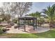 Backyard gazebo with fire pit and landscaping at 19530 E Via Del Oro --, Queen Creek, AZ 85142