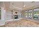 Living room featuring a fireplace and built-in shelving at 19530 E Via Del Oro --, Queen Creek, AZ 85142